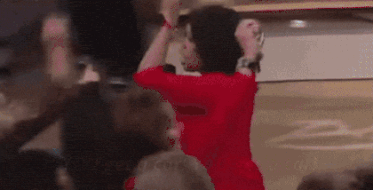 Oprah gesturing to the crowd, 'you get a car'